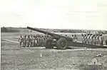 'T' Australian Heavy Battery at Fort Lytton with M1917/1918 155-millimetre (6.1&nbsp;in) heavy gun. Heads are bowed during a ceremony on Armistice Day 1943