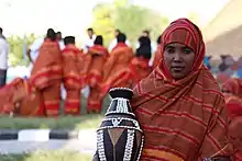 Image 37A Somali woman showing a decorated pottery (from Culture of Somalia)