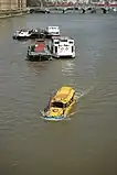 Amphibious tour bus&nbsp;– a converted DUKW&nbsp;– on Thames river in London near Lambeth Bridge.