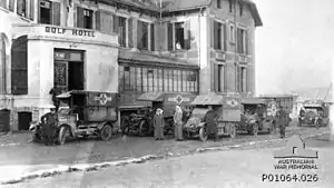 Ambulances outside the Australian Voluntary Hospital at the Hôtel du Golf et Cosmopolite in Wimereux. The ambulances carry signs indicating their donors, such as the "Red Cross Society, Queensland"
