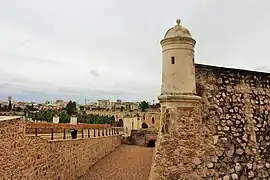 Eastern flank with bartizan, moat and San Vicente Gate
