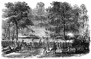 Black and white battle sketch shows a line of soldiers with the US flag in the woods firing at a distant line of soldiers with the Confederate flag.