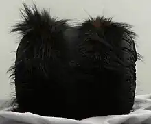 Black muff with fur trim