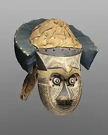 Pwoom Itok mask; late 19th century; 39.1 x 28.6 x 29.8&nbsp;cm (153⁄8 x 111⁄4 x 113⁄4 in.); Brooklyn Museum (USA). This mask may have represented a wise older man at boys' initiations. One of the principal Kuba dance masks is called pwoom itok. The chief identifying characteristic is the shape of the eyes, whose centers are cones surrounded by holes through which the wearer sees