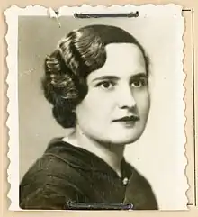 B&W portrait photo of a young woman with short wavy hair.
