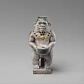 Cosmetic container; 525–404 BC; faience; height: 9.2 cm, width: 4.4 cm; Metropolitan Museum of Art