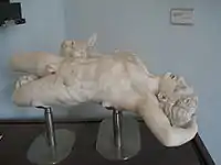 A companion of Odysseus being attacked by one of Scylla's dog-heads. From Hadrian's Villa. In the Sperlonga reconstruction the equivalent figure is vertical and upside down.