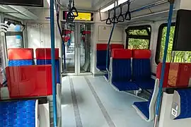 Passenger seats and gangway inside intermediate car of Ivolga-2.0.