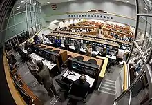 Bolden, left, congratulates Leinbach and the launch team in Firing Room Four of the Launch Control Center for a successful launch.