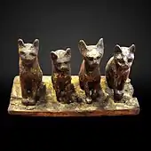 Four cats; 664–332 BC; wood; height: 14&nbsp;cm, width: 27&nbsp;cm; Louvre