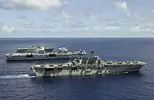 JS Ise alongside USS&nbsp;America and HMS&nbsp;Queen Elizabeth on 24 August 2021.
