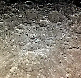 Exaggerated color image by MESSENGER with Bernini, Cervantes, and Van Gogh at top