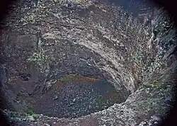 Pit crater with an inner pit, an open vertical volcanic conduit