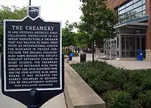 An information plaque for The Creamery erected by the Alumni Association