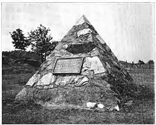 Monument erected 1904 by the Jackson Iron Company at the site of the discovery of ore after destruction of the stump.  The monument is now located on US&nbsp;41.
