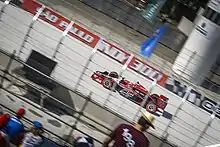 Photograph of Wilson driving his Dreyer & Reinhold racing car