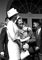 In 1961, Louise Shepard wore a lampshade hat with front bow at a NASA award ceremony for her husband Alan B. Shepard