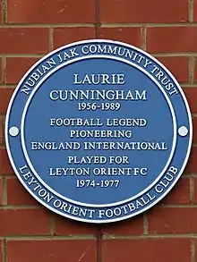 Blue plaque outside Brisbane Road