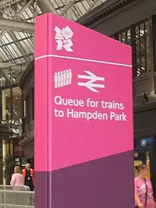 Olympics branding on a sign at Glasgow Central station, showing passengers where to queue for trains to Hampden Park