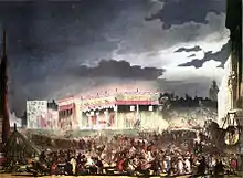 Crowds throng the streets filled with rides and lined with gaily lit buildings.