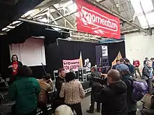 People gathered around a stage