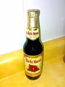 Noche Buena beer, showing the Noche Buena (Poinsettia) and a volume of 355&nbsp;ml (12.0&nbsp;U.S.&nbsp;fl&nbsp;oz; 12.5&nbsp;imp&nbsp;fl&nbsp;oz) on the label.