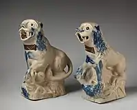 Early pair, c. 1750, copying Chinese figures. salt-glazed stoneware, c. 8.5 inches tall