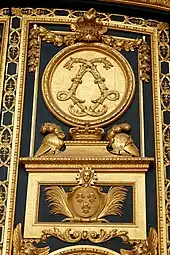 Baroque acanthuses of a monogram of Louis XIV on the entrance door of the Dôme des Invalides, Paris, by Jules Hardouin-Mansart, 1677–1706