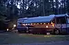 An motor home set up with party lights on the outside