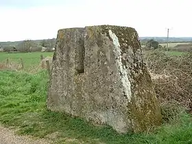 One of a pair of blocks that allowed the railway line to be blocked quickly by inserting a barrier such as a section of rail. The rail block was intended to stop enemy tracked vehicles from travelling along the railway route. The mass of concrete stands on a foundation and is about 5 feet (1.5&nbsp;m) high.
