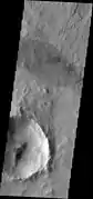 A. Dark slope streaks are the tiny, linear albedo features along the SE wall of the crater. Compare with the far larger, wind-related albedo feature (oval patch at center top of image). This image is a THEMIS VIS from the Mars Odyssey spacecraft. It is about 25&nbsp;km wide. North is at top.