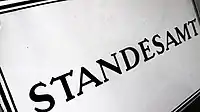An enamel sign representing a Standesamt in 1950
