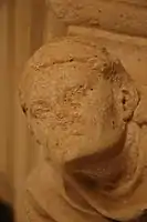 Detail of a capital of the fireplace of the reception room (14th century)