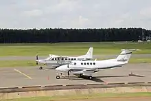 Two planes on the runway of Eldoret International Airport.