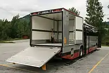 Image 1612003 Volvo 9700S on B12M from Telemark Bilruter, with all doors open. Manual pallet jack is standard equipment for single-person operation. (from Bruck (vehicle))