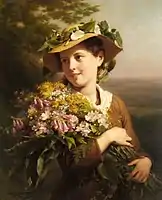 A young beauty holding a bouquet of flowers